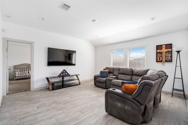 8219 Molasses Way, Rosharon, TX 77583 - living room featuring wood finished floors, vaulted ceiling, and baseboards