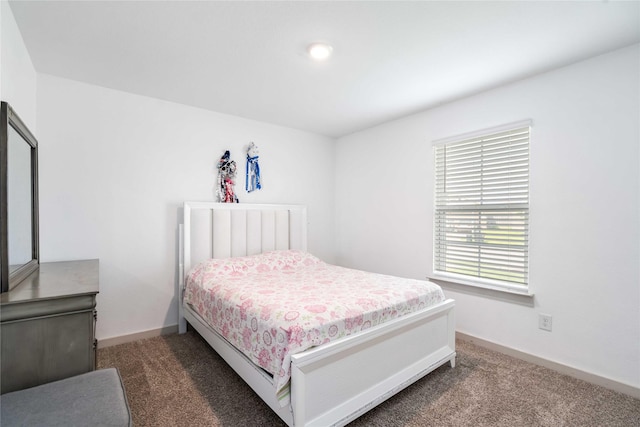 8219 Molasses Way, Rosharon, TX 77583 - bedroom featuring dark carpet and baseboards