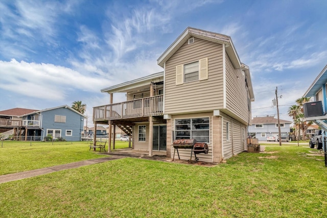 457 Pompano St, Bayou Vista, TX 77563 - back of house with a lawn and a wooden deck