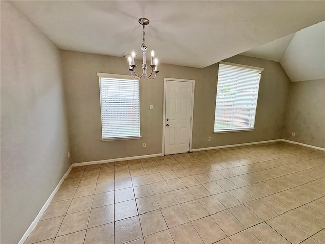 2662 Kiplands Way Dr, Houston, TX 77014 - unfurnished dining area featuring a chandelier, light tile patterned flooring, baseboards, and lofted ceiling