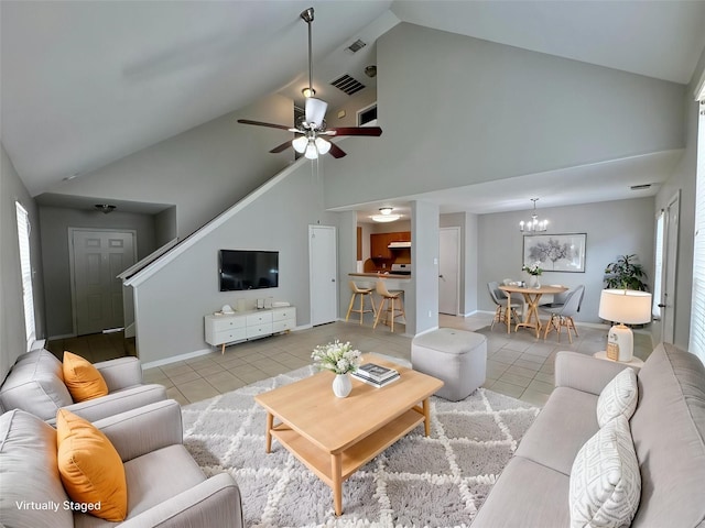 2662 Kiplands Way Dr, Houston, TX 77014 - living area featuring light tile patterned floors, high vaulted ceiling, a chandelier, a ceiling fan, and baseboards