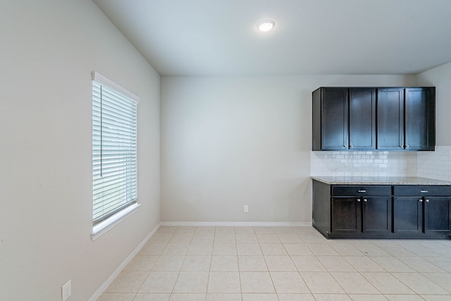 16659 Bluefin St, Crosby, TX 77532 - spare room featuring baseboards and light tile patterned floors