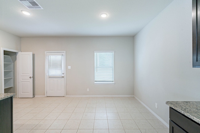 16659 Bluefin St, Crosby, TX 77532 - empty room with baseboards, light tile patterned floors, and recessed lighting