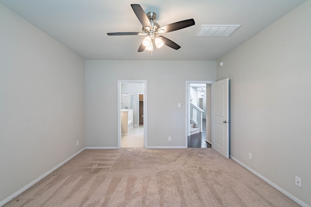 16659 Bluefin St, Crosby, TX 77532 - unfurnished bedroom with light colored carpet, ensuite bath, baseboards, and ceiling fan