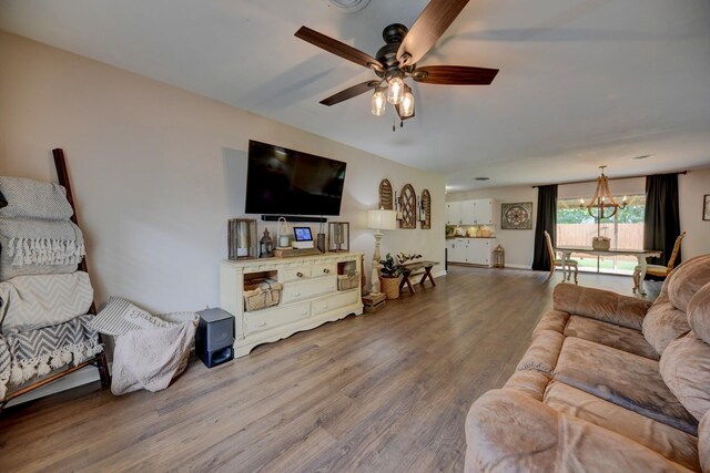 507 Sandra Dr, Brenham, TX 77833 - living area featuring a chandelier, a ceiling fan, and wood finished floors