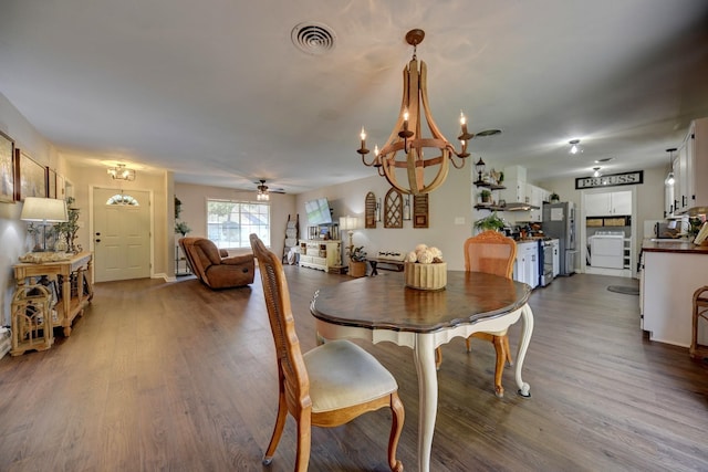 507 Sandra Dr, Brenham, TX 77833 - dining space featuring a chandelier, dark wood-style floors, and ceiling fan
