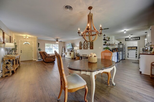 507 Sandra Dr, Brenham, TX 77833 - dining area with a chandelier, dark wood-type flooring, and a ceiling fan