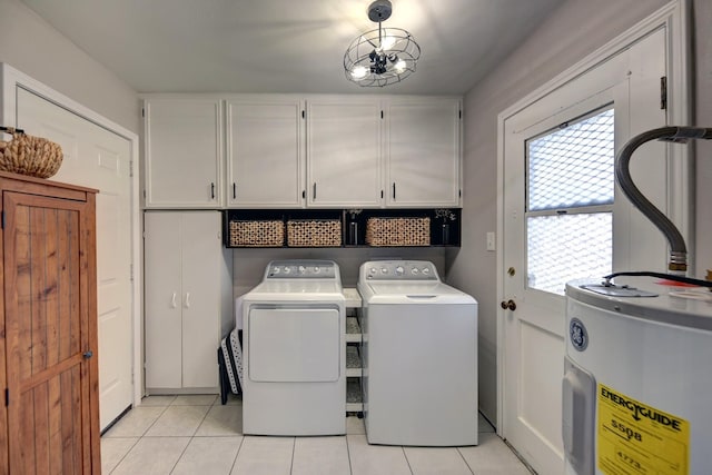 507 Sandra Dr, Brenham, TX 77833 - laundry area featuring water heater, cabinet space, light tile patterned flooring, and separate washer and dryer