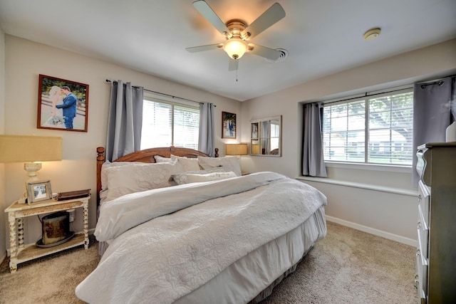 507 Sandra Dr, Brenham, TX 77833 - bedroom with light carpet, baseboards, and ceiling fan