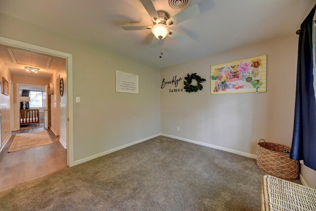 507 Sandra Dr, Brenham, TX 77833 - carpeted empty room featuring attic access, a ceiling fan, and baseboards