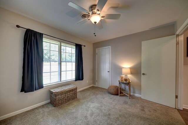 507 Sandra Dr, Brenham, TX 77833 - bedroom featuring carpet floors, baseboards, and a ceiling fan