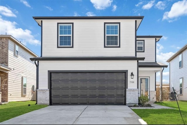 10721 Bancroft Park Ln, Houston, TX 77075 - traditional home with concrete driveway, a garage, a front lawn, and brick siding