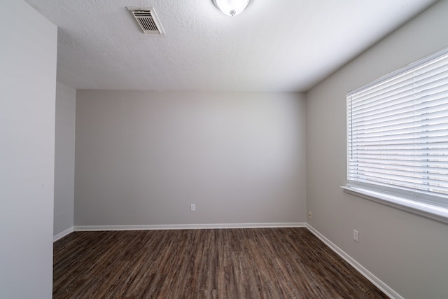 19914 Big Timber Dr, Humble, TX 77346 - unfurnished room featuring dark wood finished floors and baseboards