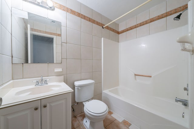 19914 Big Timber Dr, Humble, TX 77346 - bathroom featuring tile walls, bathtub / shower combination, vanity, and tile patterned flooring