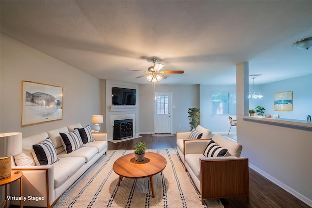 19914 Big Timber Dr, Humble, TX 77346 - living area with wood finished floors, a large fireplace, and ceiling fan