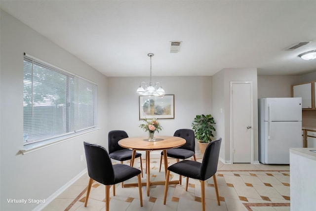 19914 Big Timber Dr, Humble, TX 77346 - dining space with a chandelier and light tile patterned floors