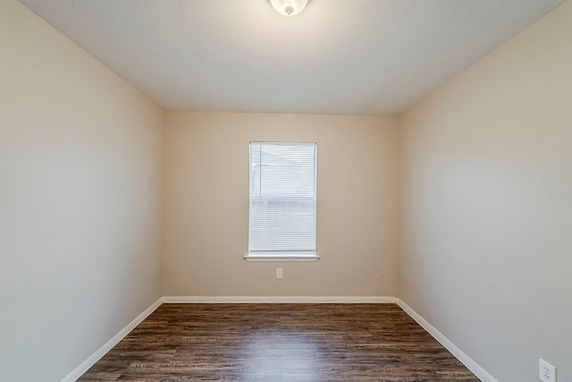 2511 Muscory Dr, Humble, TX 77396 - spare room with dark wood-style flooring and baseboards
