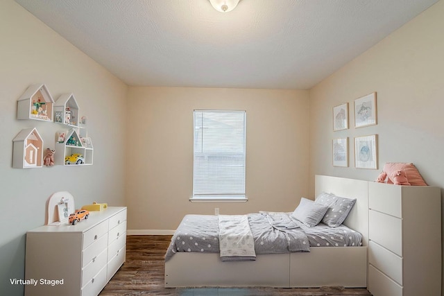 2511 Muscory Dr, Humble, TX 77396 - bedroom with dark wood-style floors and baseboards