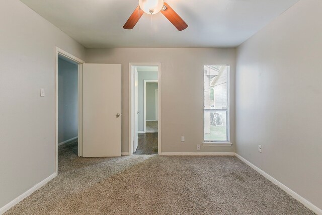 3014 Misty Park Dr, Houston, TX 77082 - unfurnished bedroom with multiple windows, carpet, and baseboards
