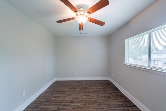 447 Vane Way, Crosby, TX 77532 - spare room with dark wood-style flooring, baseboards, and ceiling fan