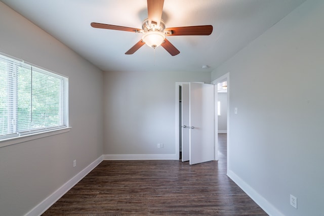 447 Vane Way, Crosby, TX 77532 - spare room with dark wood-style floors, baseboards, and ceiling fan