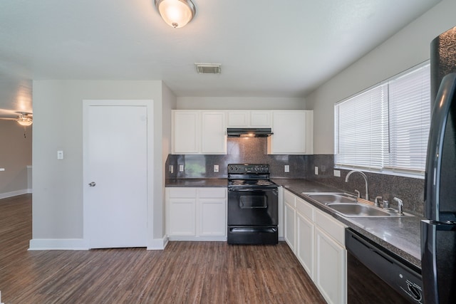 447 Vane Way, Crosby, TX 77532 - kitchen with black appliances, a sink, under cabinet range hood, dark wood-style floors, and decorative backsplash