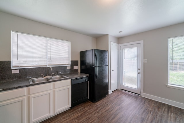 447 Vane Way, Crosby, TX 77532 - kitchen featuring black appliances, a sink, dark countertops, and dark wood-type flooring