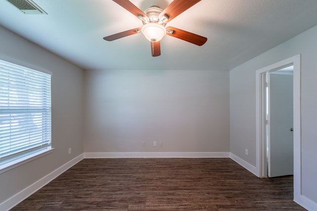 447 Vane Way, Crosby, TX 77532 - unfurnished room featuring plenty of natural light, dark wood finished floors, and baseboards