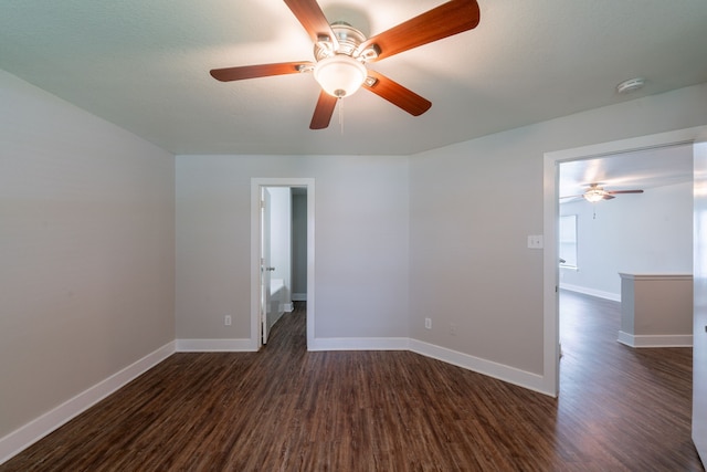 447 Vane Way, Crosby, TX 77532 - spare room featuring dark wood-style flooring, ceiling fan, baseboards, and a smoke detector