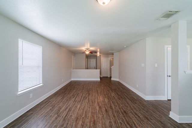 447 Vane Way, Crosby, TX 77532 - unfurnished living room with dark wood-style flooring, baseboards, and ceiling fan