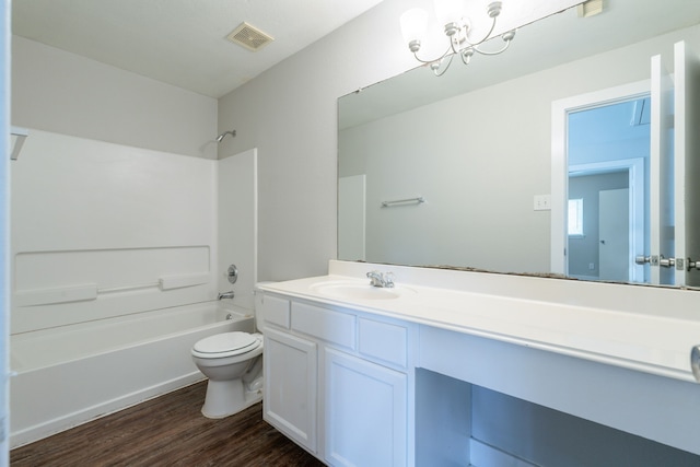 447 Vane Way, Crosby, TX 77532 - full bathroom featuring toilet, vanity, wood finished floors, shower / bathtub combination, and a chandelier