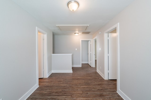 447 Vane Way, Crosby, TX 77532 - hallway featuring attic access, dark wood finished floors, and baseboards