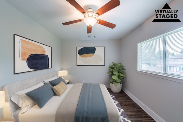 447 Vane Way, Crosby, TX 77532 - bedroom with dark wood-style flooring, baseboards, and a ceiling fan