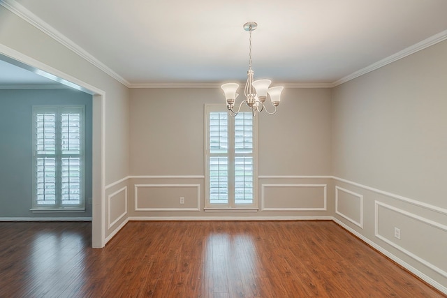 5206 Graystone Ln, Houston, TX 77069 - empty room featuring dark wood-style flooring, a chandelier, a wainscoted wall, crown molding, and a decorative wall