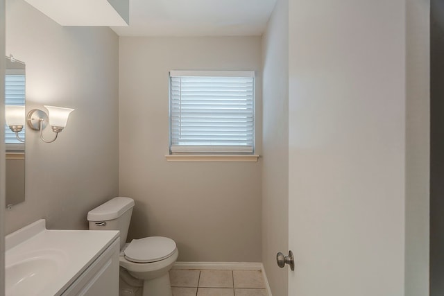 5206 Graystone Ln, Houston, TX 77069 - half bathroom featuring toilet, tile patterned flooring, vanity, and baseboards