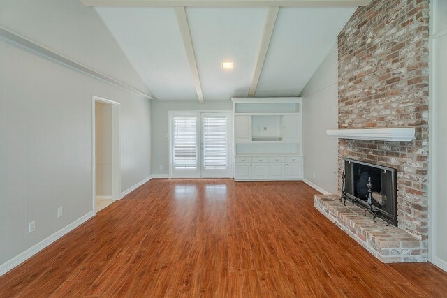 5206 Graystone Ln, Houston, TX 77069 - unfurnished living room featuring wood finished floors, a fireplace, and baseboards