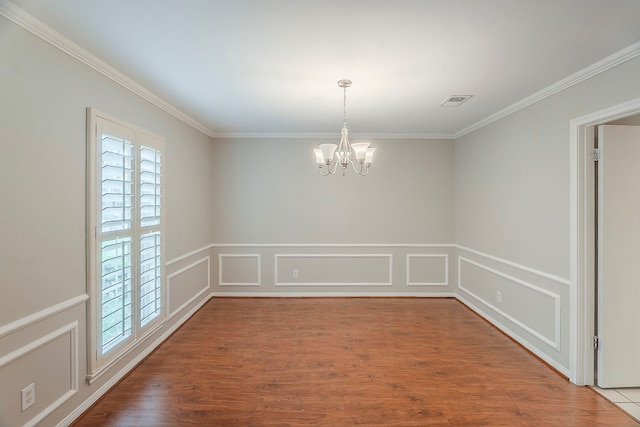 5206 Graystone Ln, Houston, TX 77069 - empty room featuring a chandelier, crown molding, a wainscoted wall, wood finished floors, and a decorative wall
