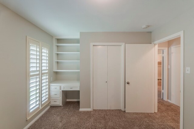 5206 Graystone Ln, Houston, TX 77069 - unfurnished bedroom with carpet, a desk, and a closet