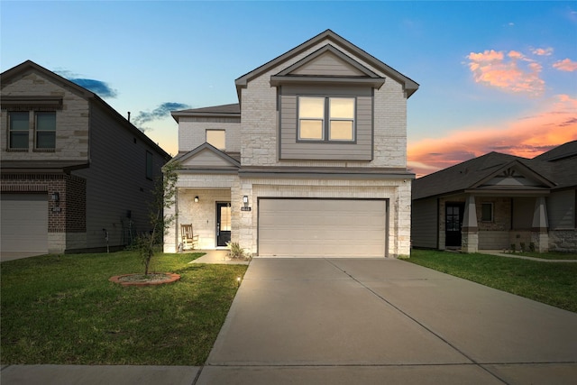 6846 Termino Ln, Rosharon, TX 77583 - view of front of home with an attached garage, a yard, concrete driveway, stone siding, and brick siding