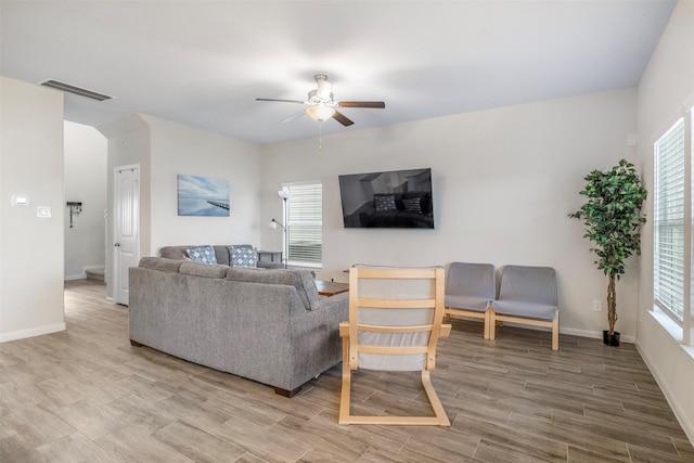 6846 Termino Ln, Rosharon, TX 77583 - living room with ceiling fan, wood finished floors, plenty of natural light, and baseboards