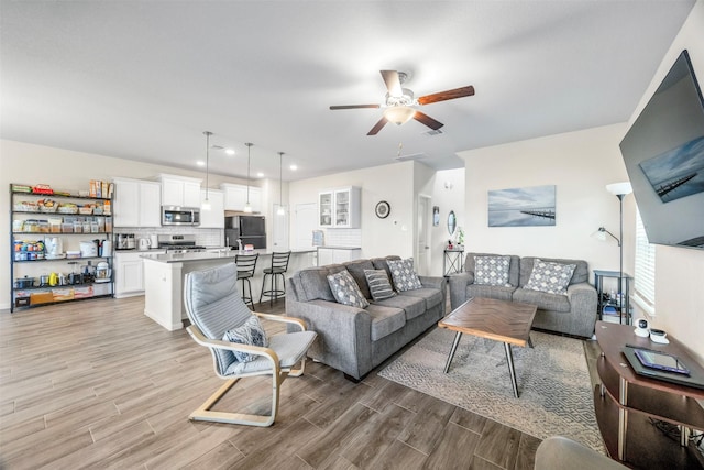 6846 Termino Ln, Rosharon, TX 77583 - living room featuring ceiling fan and light wood-style flooring