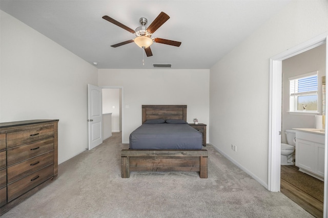 6846 Termino Ln, Rosharon, TX 77583 - bedroom with light carpet, ensuite bathroom, and ceiling fan