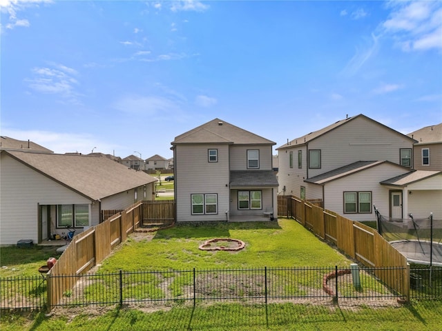 6846 Termino Ln, Rosharon, TX 77583 - back of property with a residential view and a trampoline