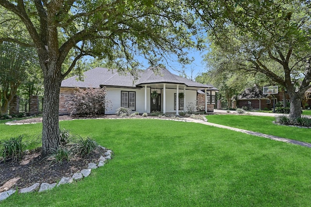 704 Balmoral Ct, Friendswood, TX 77546 - view of front of property with a front lawn and roof with shingles