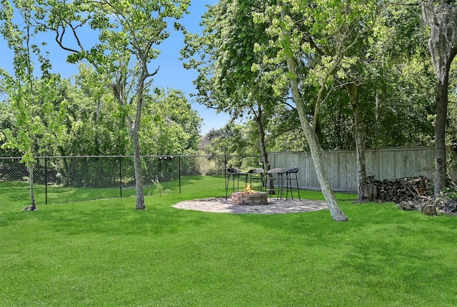 704 Balmoral Ct, Friendswood, TX 77546 - view of yard with an outdoor fire pit and a patio area