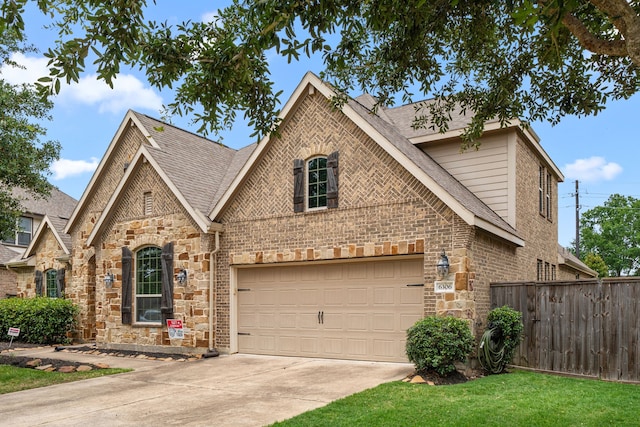 6306 Sunstone Fls, Katy, TX 77493 - view of front of house featuring stone siding, concrete driveway, and brick siding