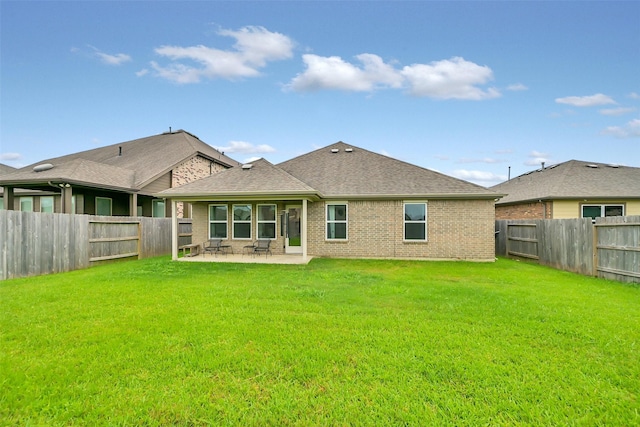 12307 Sabine Point Dr, Humble, TX 77346 - rear view of house featuring a patio area, brick siding, and roof with shingles