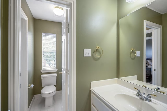11802 Rue Saint Honore Ct, Tomball, TX 77377 - bathroom featuring vanity, toilet, tile patterned floors, and baseboards