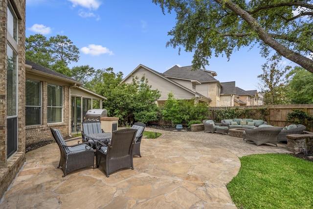11802 Rue Saint Honore Ct, Tomball, TX 77377 - fenced backyard featuring outdoor lounge area, a patio, outdoor dining space, and exterior kitchen