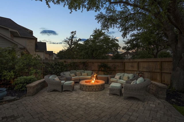 11802 Rue Saint Honore Ct, Tomball, TX 77377 - fenced backyard with an outdoor living space with a fire pit and a patio